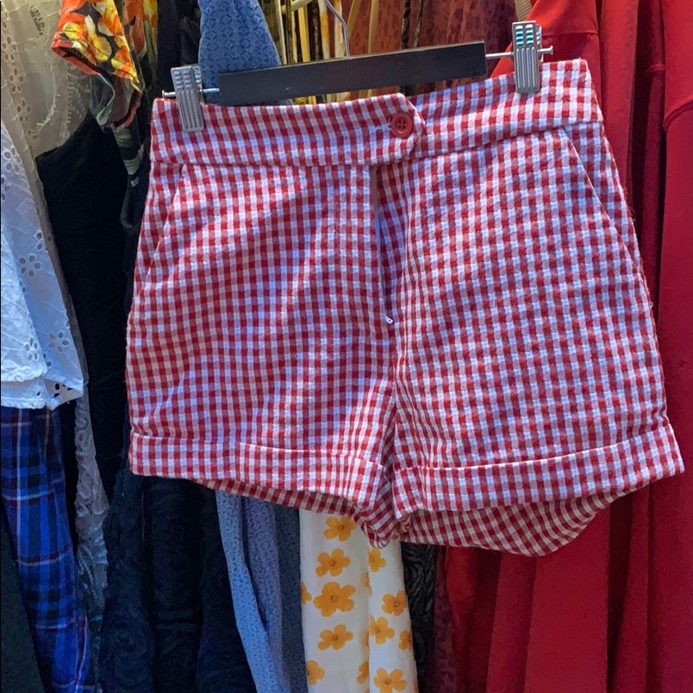 Red and white checkered shorts.
